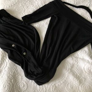 Black bodycon midi dress with button detail.